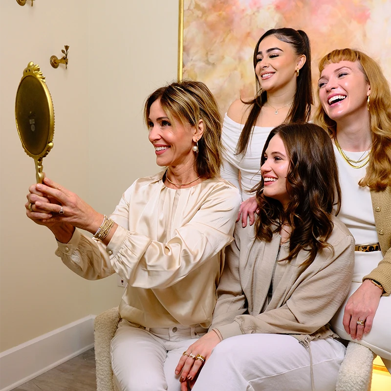 Facials Brookfield WI Staff Smiling at Mirror Together